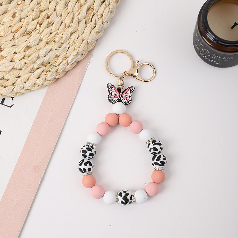 Wholesale Rubber Tassel Silicone Wood Water Keychain